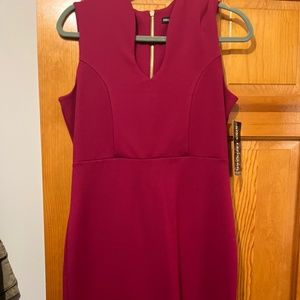 Bright bold color dress with sexy neck line. Size M